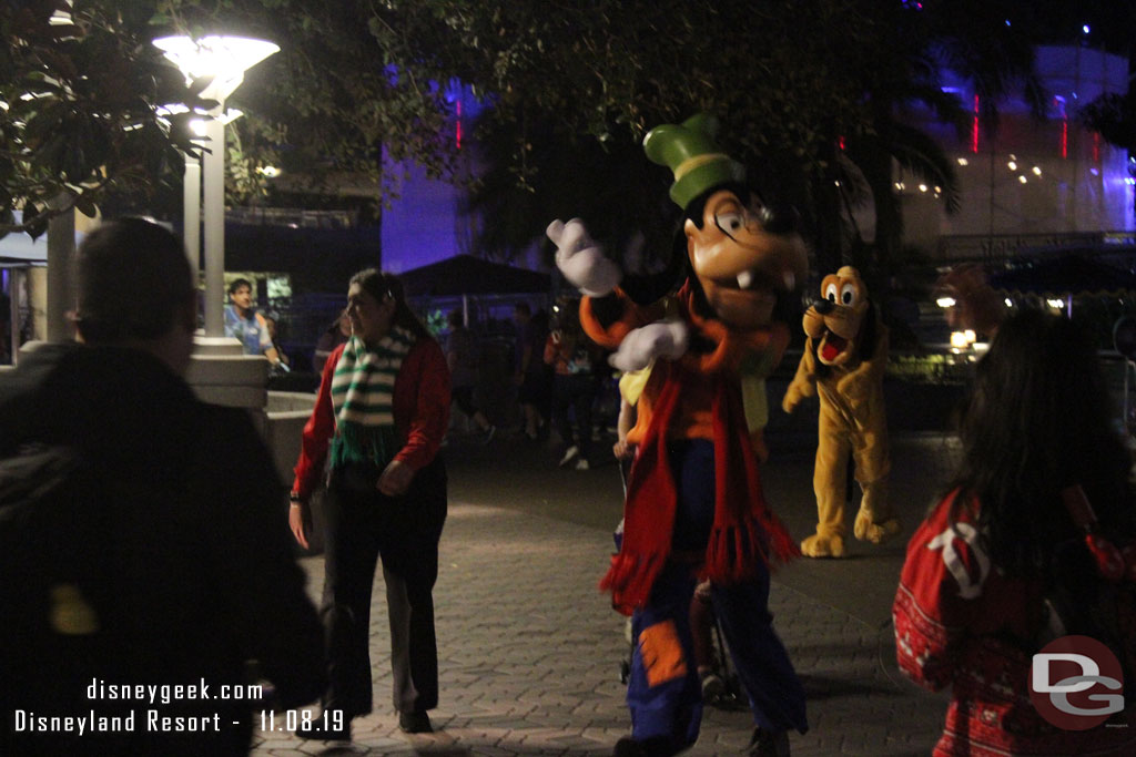 Goofy and Pluto arriving for the Holiday Dance Party in Tomorrowland.