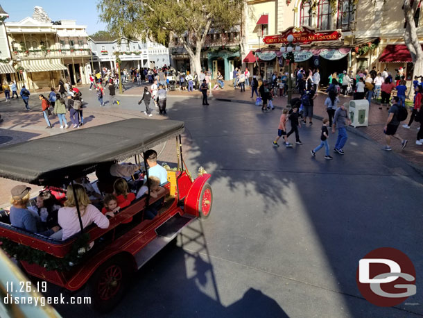 Being passed by the red car.