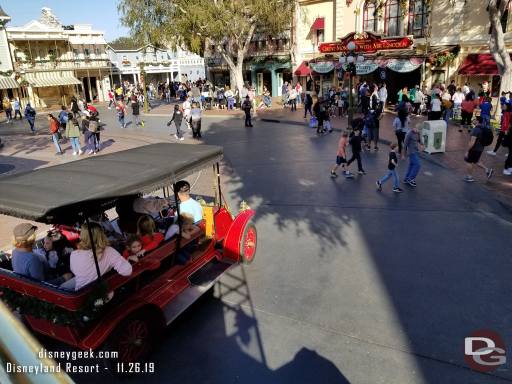 Being passed by the red car.