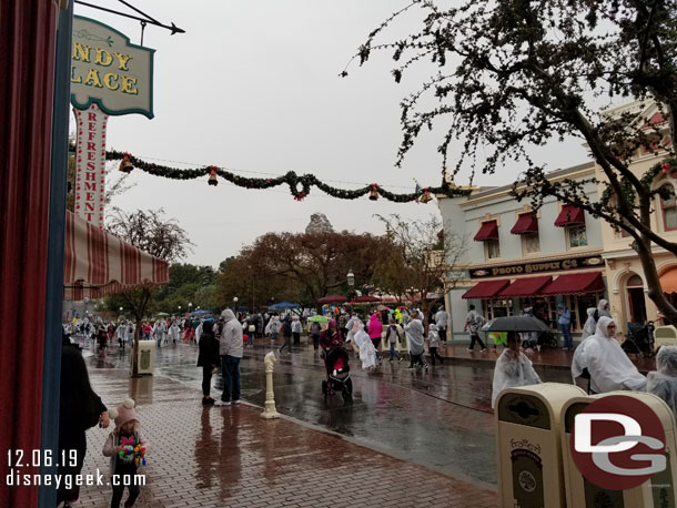 An announcement played saying A Christmas Fantasy Parade was cancelled due to the weather but Mickey's Holiday Cavalcade would be arriving shortly.