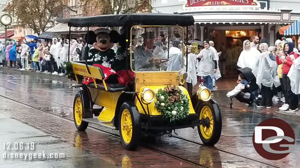 Mickey Mouse and Minnie Mouse in the second car.