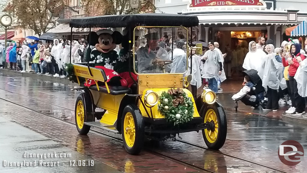 Mickey Mouse and Minnie Mouse in the second car.