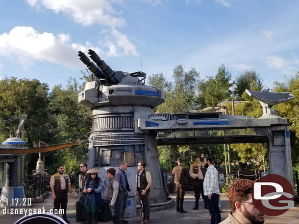 A second line of cast members at the attraction entrance.