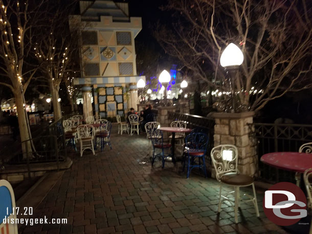 The upper terrace of the small world mall has tables and chairs.