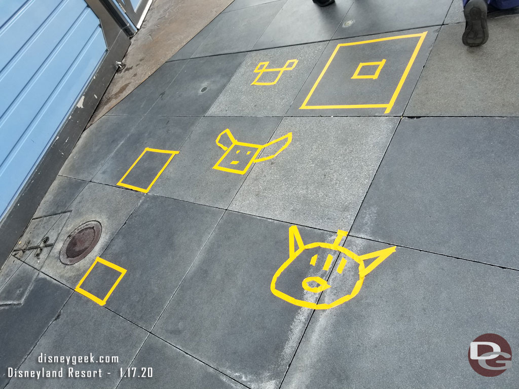 Cast members having some fun in the Tomorrowland stroller parking area.  Can you identify the tape art figures?  I was able to and they were very happy someone understood what they created.