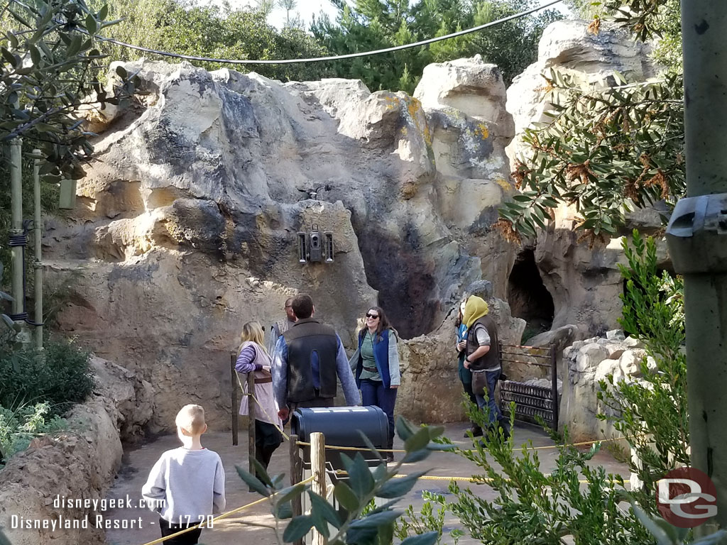 Another line of cast members in the queue scanning park tickets.