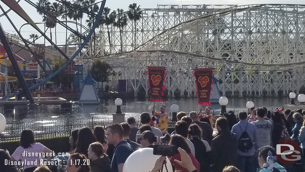 The procession arriving in Paradise Gardens Park. It starts at the parade gate between Pixar Pier and Paradise Gardens.