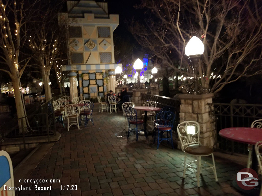 The upper terrace of the small world mall has tables and chairs.