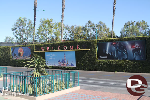 Parking structure tram stop billboards feature Rise of the Resistance and Pixar Pier. 