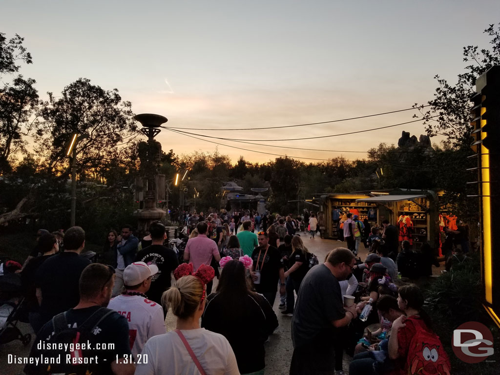 A number of guests milling around the Resistance area waiting for the boarding group to be called.