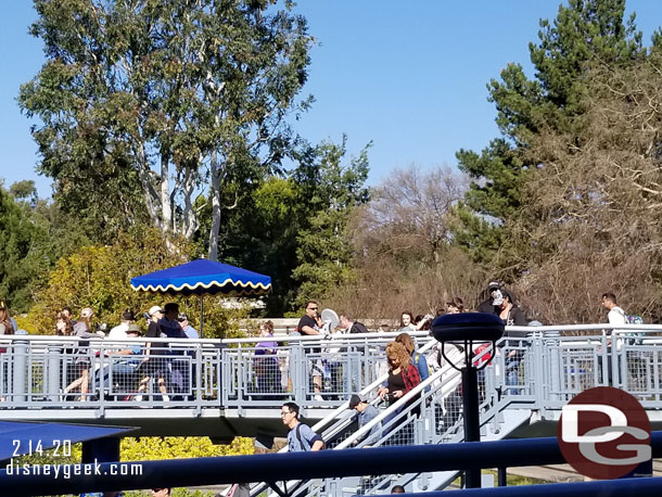 It appeared the merge point was under this umbrella.  There was a Cast Member there with a handheld scanner and if you had a FastPass you were merged into the queue standby directed to the main part of the queue up the walkway.