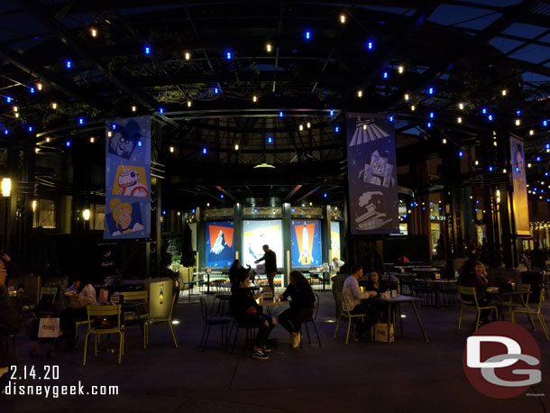 The dining area in front of the former AMC now has some character and attraction banners.