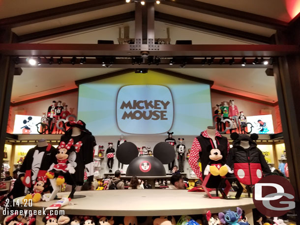 The center section features Mickey Mouse merchandise