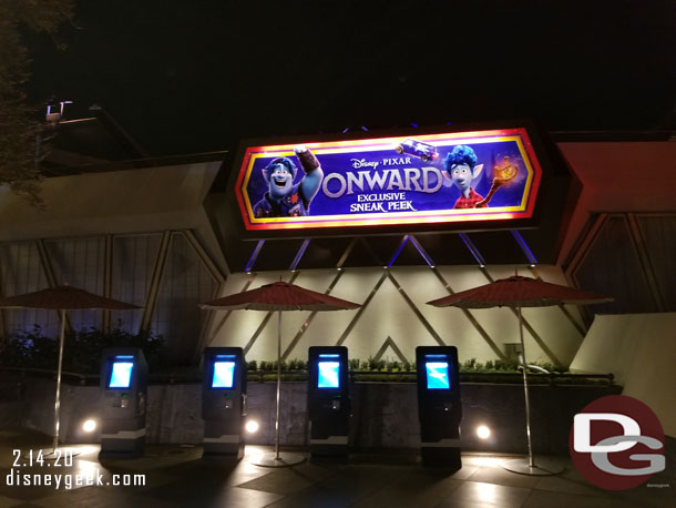 The Onward sign at night and a quiet FastPass distribution area.