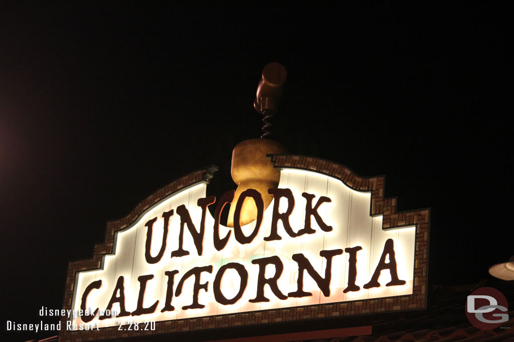 Festival Marketplace signs at night.