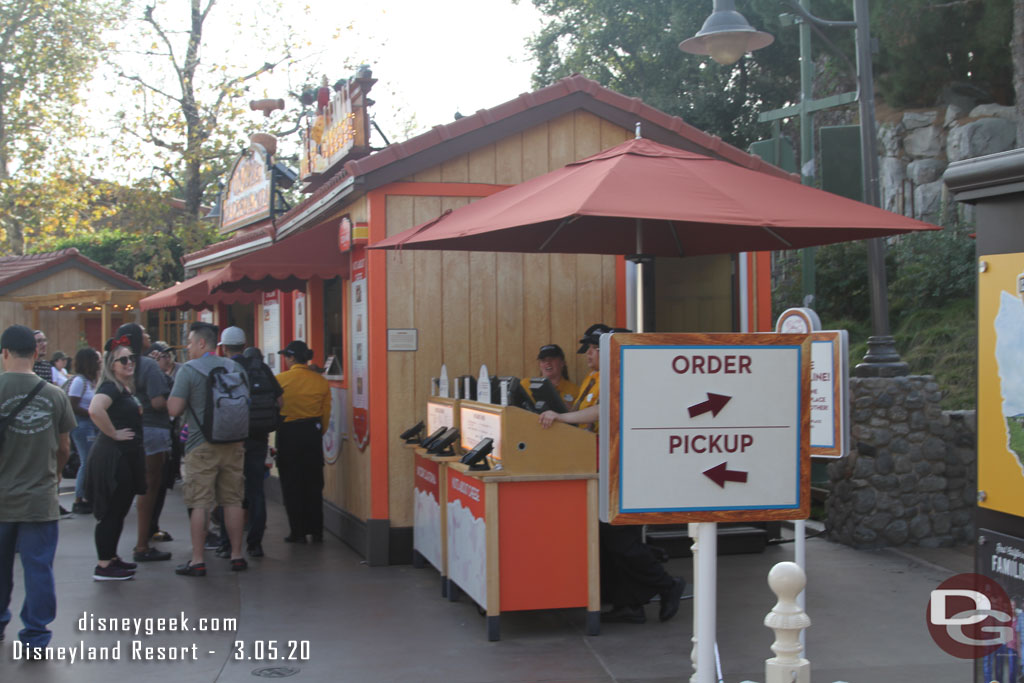 Signs up to try and guide guests to order or pick up their food.