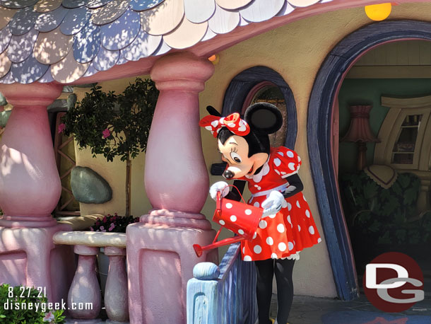 Minnie Mouse watering plants at her house