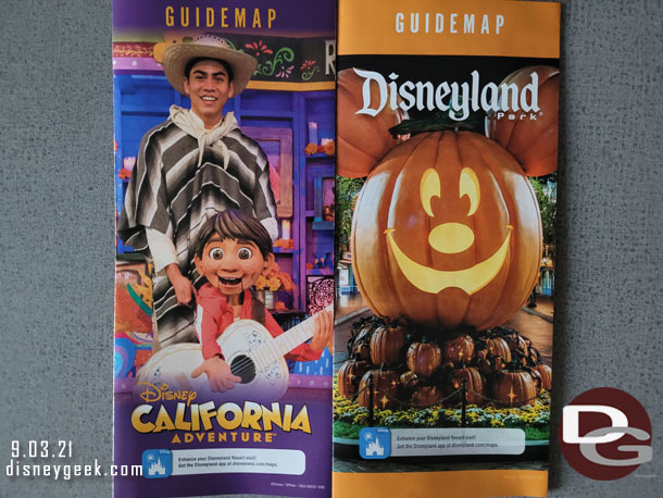 The park guide maps for both parks feature Halloween Time.