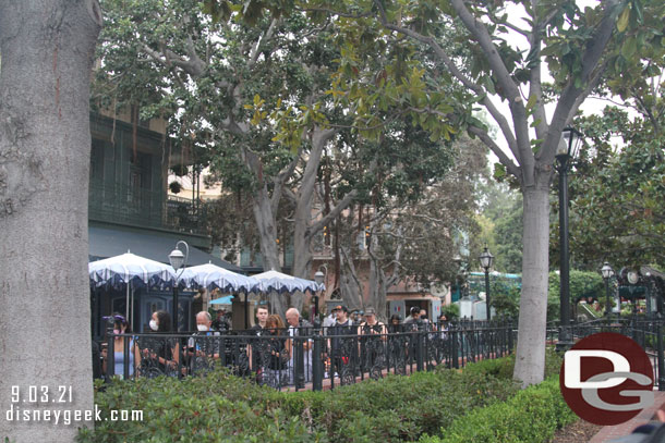 The queue grew quickly behind us and wrapped around Cafe Orleans by the French Market. They were directing guests down past the Pirates exit to join the end of the queue.