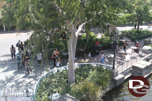 Tables eat at set up along the river near the Frontierland Landing.