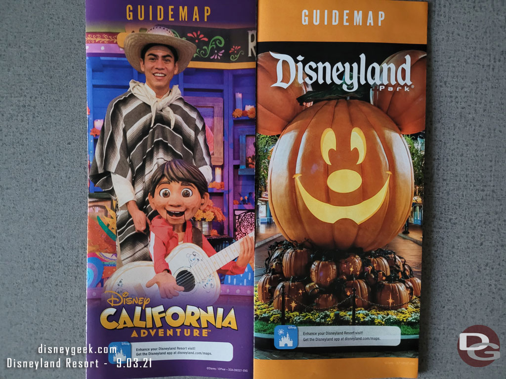 The park guide maps for both parks feature Halloween Time.