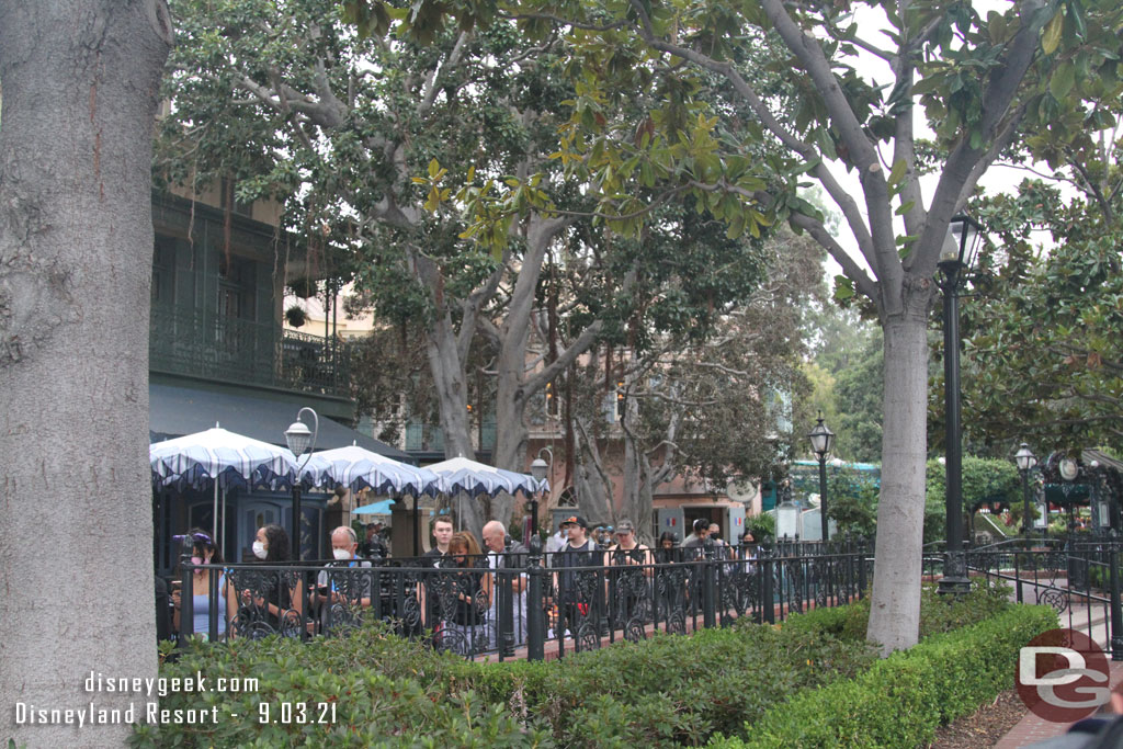 The queue grew quickly behind us and wrapped around Cafe Orleans by the French Market. They were directing guests down past the Pirates exit to join the end of the queue.