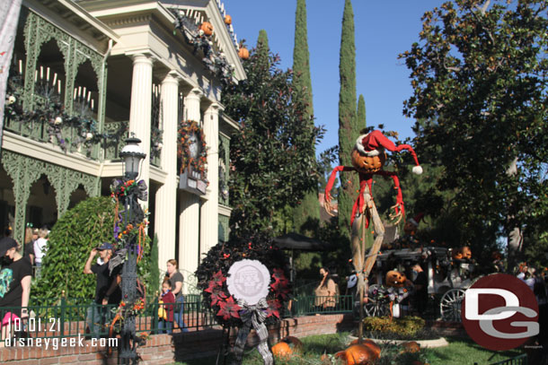 Since my first visit several weeks ago a wreath has been added to mark the 20th anniversary of the Haunted Mansion Holiday overlay.