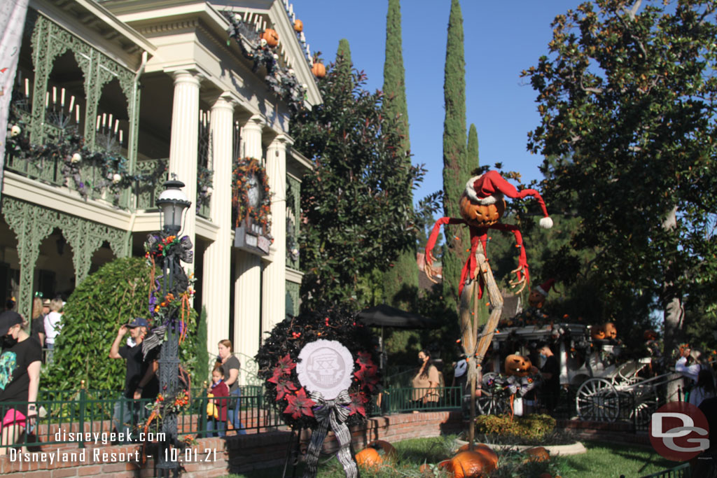 Since my first visit several weeks ago a wreath has been added to mark the 20th anniversary of the Haunted Mansion Holiday overlay.