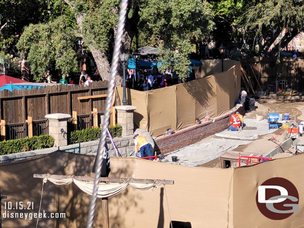 It looks like the walkway has been lowered and they are adding a few courses of brick facade.