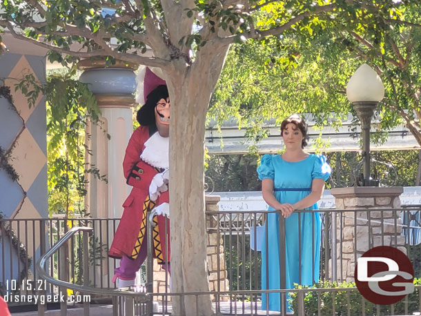 Captain Hook trying to hide near Wendy.