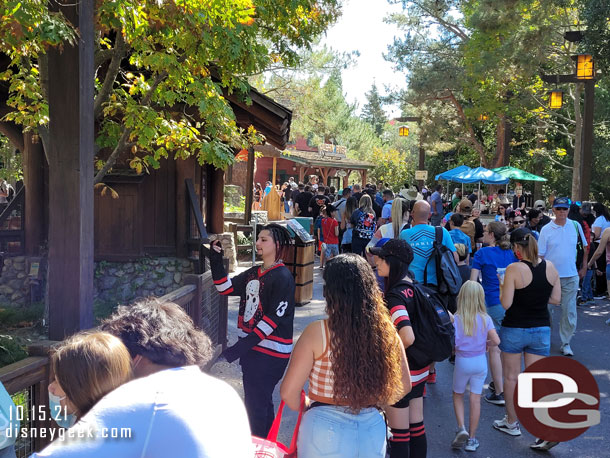 The line filled the queue, the extended queue and stretched down the walkway.