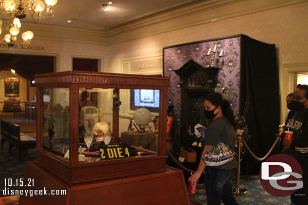 The display case in the center of the lobby and a small display near the TV have been added to promote the Muppets Haunted Mansion.