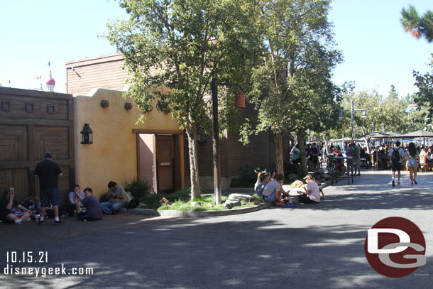 Guests finding curbs and spots in the shade to sit. The wharf was very busy this afternoon.