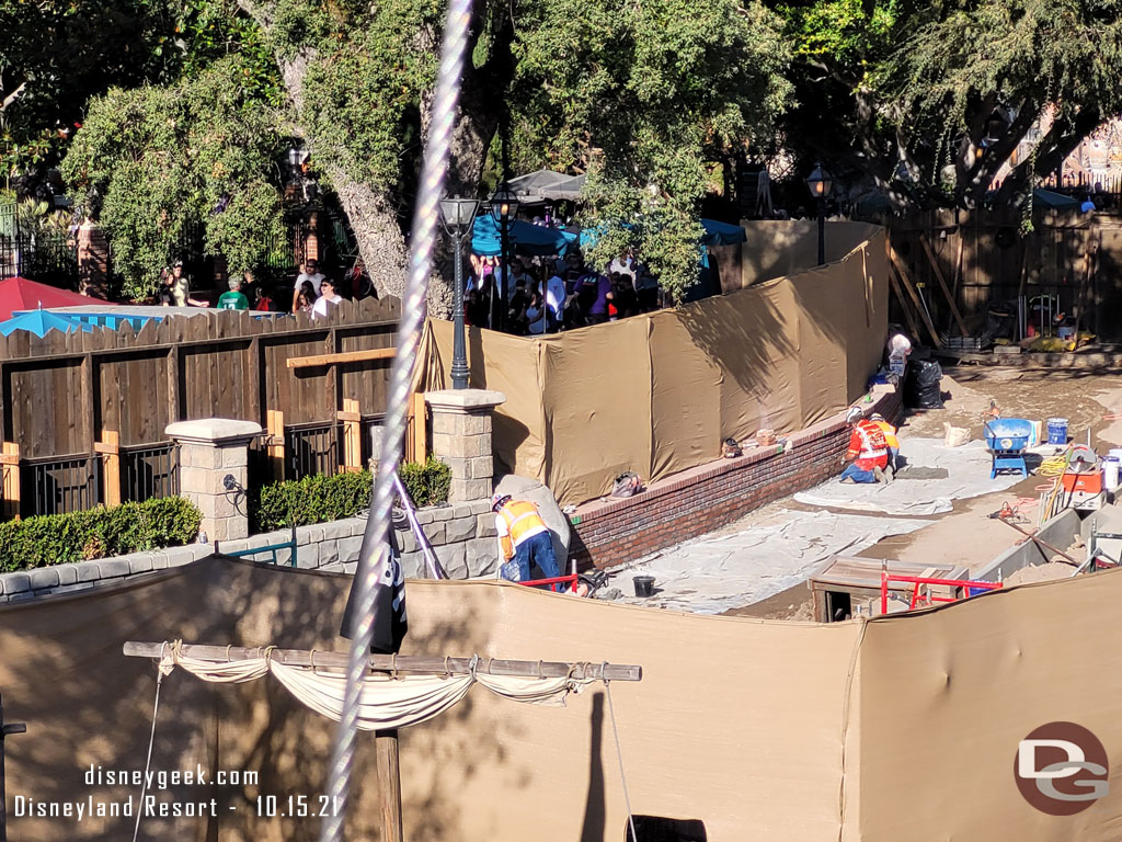 It looks like the walkway has been lowered and they are adding a few courses of brick facade.