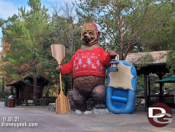 The bear has traded his pumpkin for a holiday sweater.