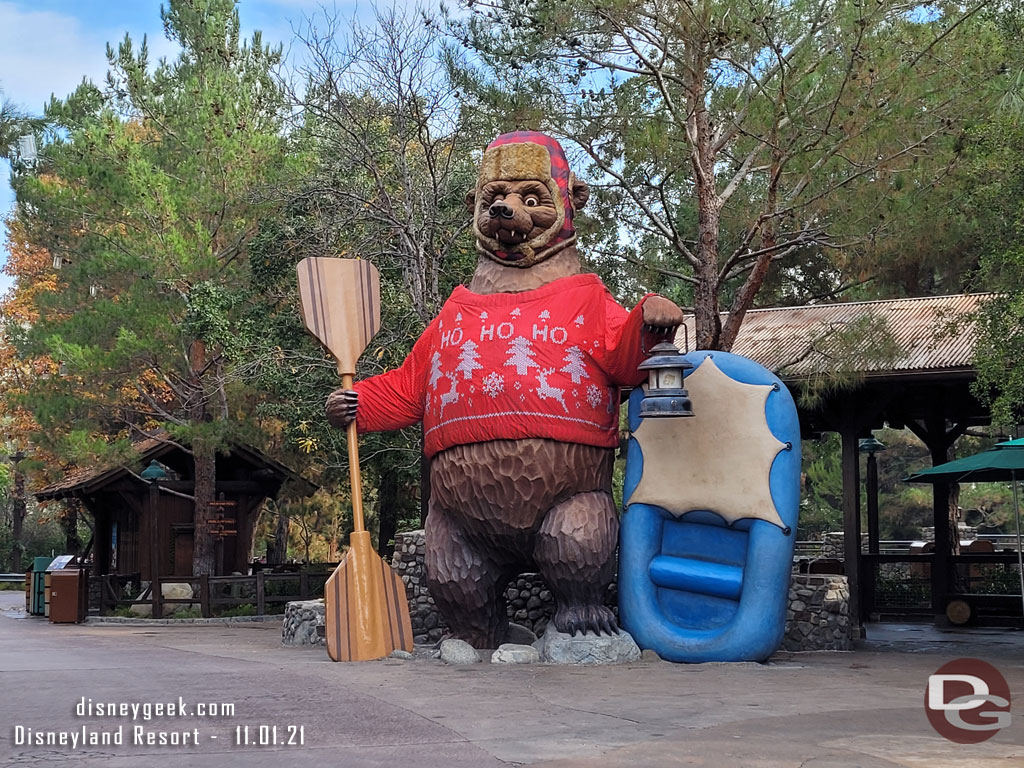 The bear has traded his pumpkin for a holiday sweater.