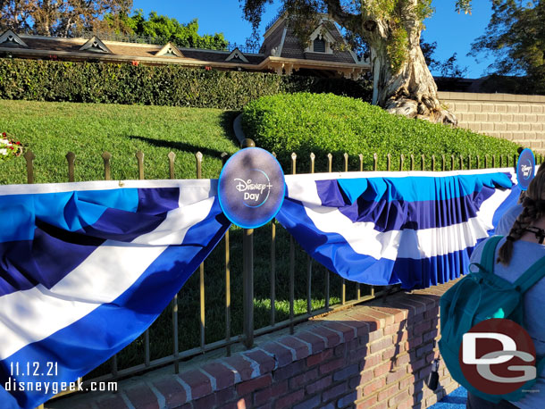 Blue bunting and signs along the rail.