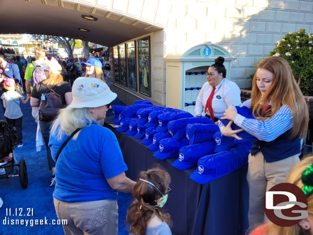 Right before the tunnels cast members were passing out free hats.