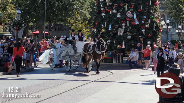 Mickey leads the cavalcade in a horse drawn carriage.