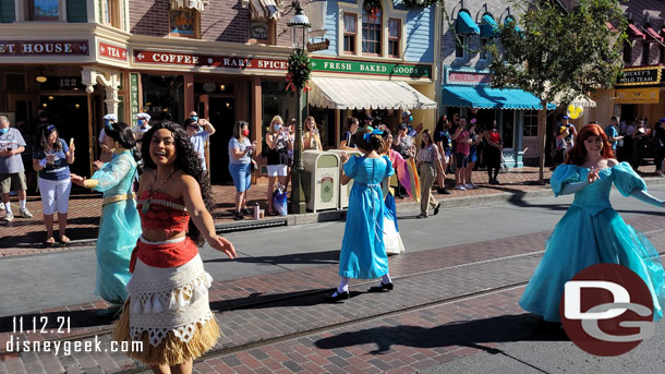 Jasmine and Mulan are also part of the Princess group walking behind the Omnibus.