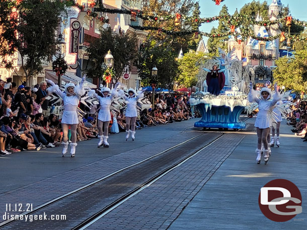 Anna, Elsa and Olaf from Frozen are on the next float.