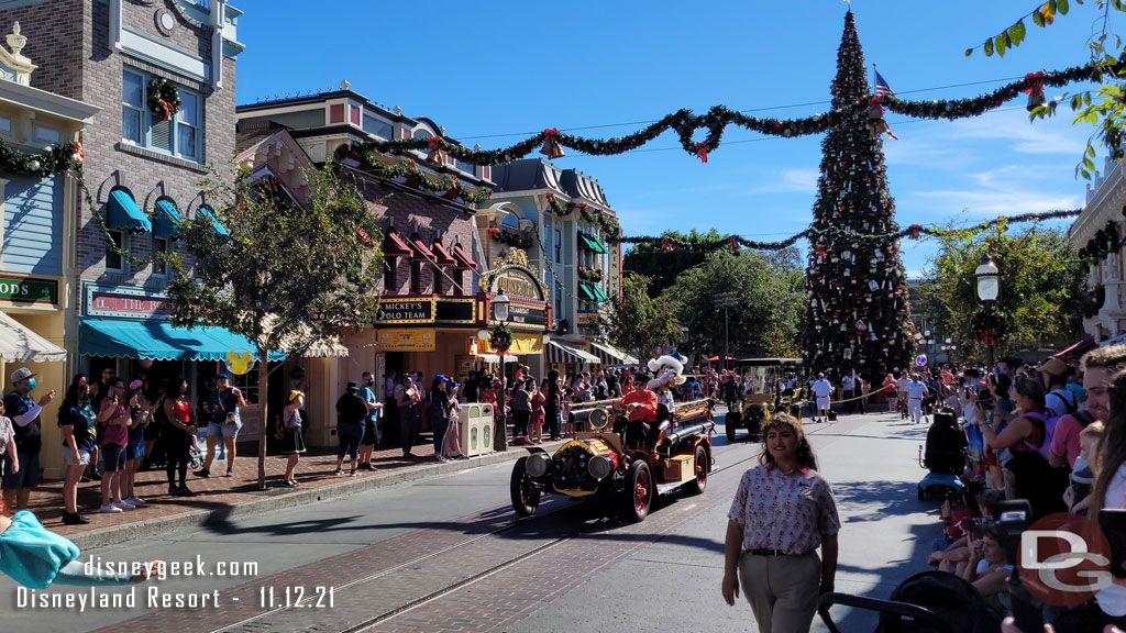 Goofy is onboard the firetruck.