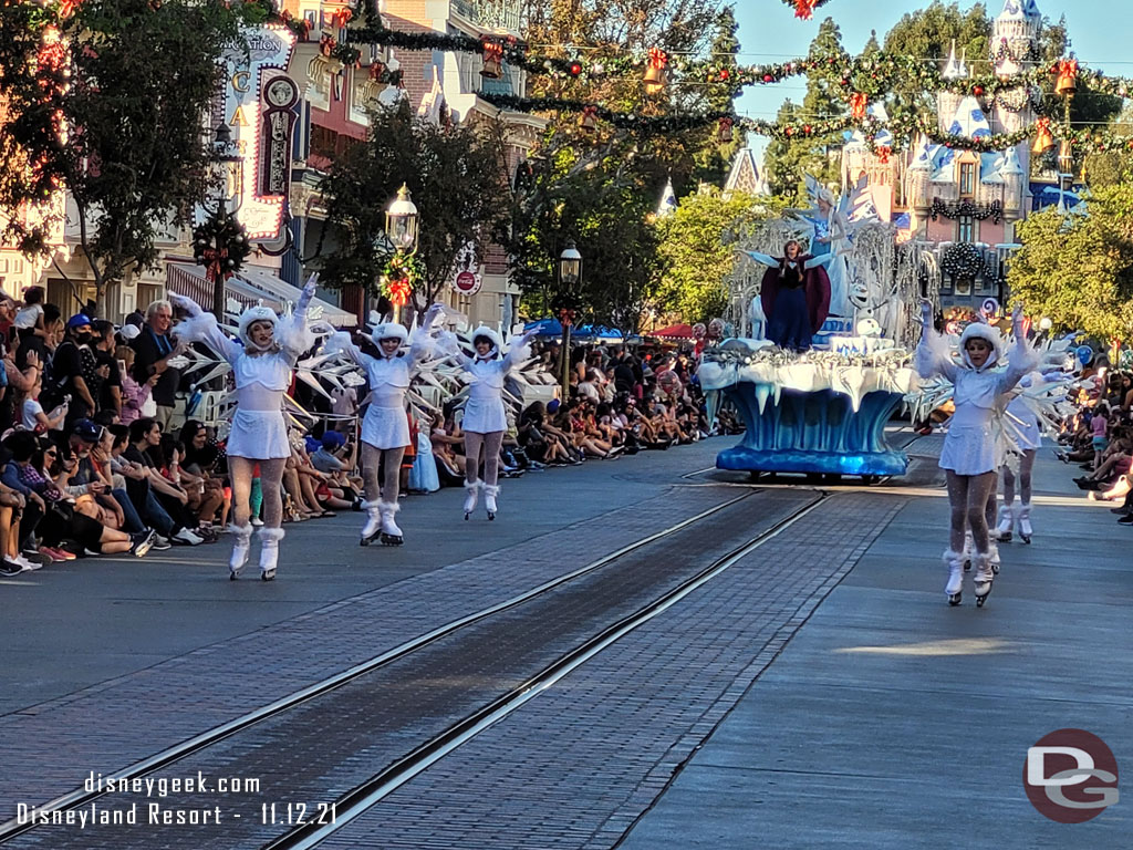 Anna, Elsa and Olaf from Frozen are on the next float.