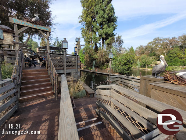 The stairs going up lead to more seating.  Going down is cast member access to the harbor.