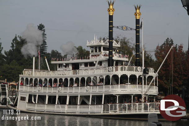 The Mark Twain Riverboat steaming by.  Notice the upper deck is still closed.