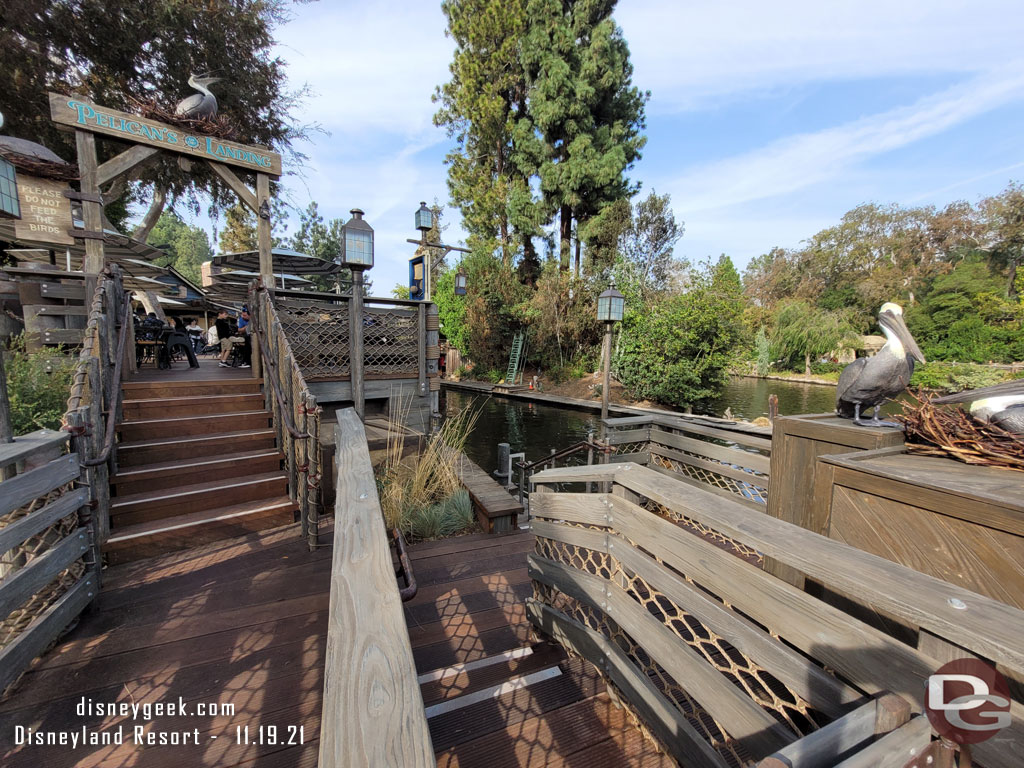 The stairs going up lead to more seating.  Going down is cast member access to the harbor.