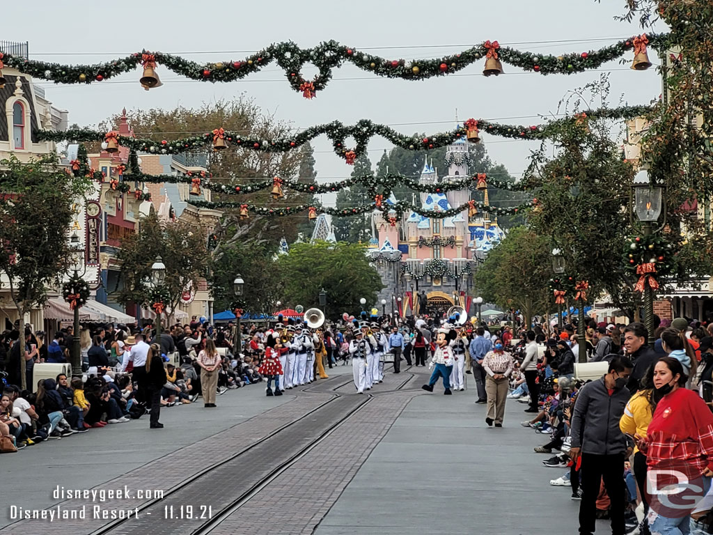 Mickey and Minnie lead the Disneyland Band toward Town Square.