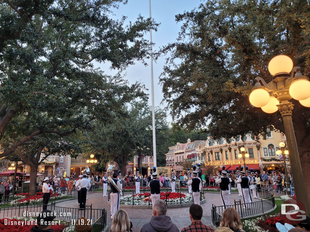 Disneyland Band and security honor guard gathered around the flag pole for the nightly Flag Retreat Ceremony.