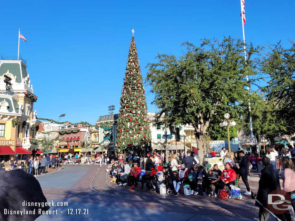 Guests lining Main Street USA waiting for the 2pm A Christmas Fantasy Parade to arrive.