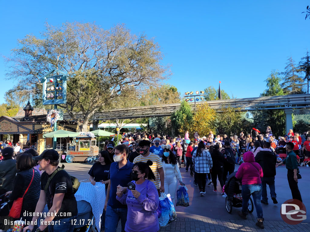 I was held up by Cast Members at the parade crossing.  They have tweaked the traffic flow slightly.  to my right are guests crossing toward the Matterhorn.  To my left are guests making their way to Fantasyland.  Once the parade crossing finishes they the